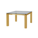 MESA DE COMEDOR CON TOPE DE VIDRIO TRANSPARENTE Y ACERO EN ACABADO DORADO