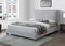 CAMA QUEEN EN TELA GRIS Y PATAS ACABADO DE MADERA