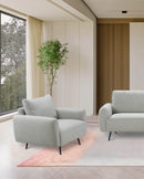 BUTACA ESTACIONARIA EN TELA GRIS Y PATAS NEGRAS