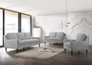 SOFA ESTACIONARIO DE TRES ASIENTOS  TAPIZADO EN TELA GRIS Y PATAS NEGRAS HS304