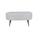 BANCO EN TELA BEIGE CON PATAS NEGRAS CON CASQUILLOS DORADOS